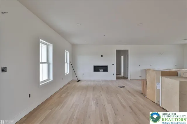 a view of kitchen with furniture and wooden floor