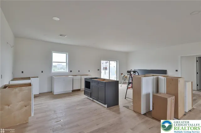 a view of a room with furniture window and wooden floor
