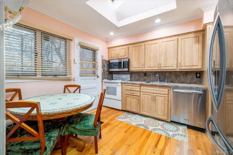 a kitchen with a stove a sink and a refrigerator