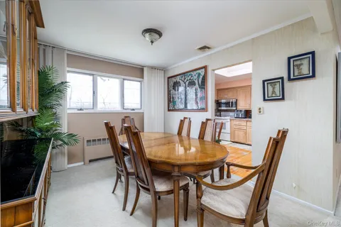 a view of a dining room with furniture and window