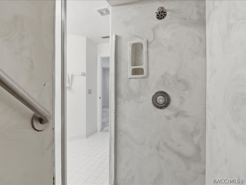 709 Moray Drive Inverness, FL 34453 - Photo 25 of 55 Primary Bath with walk-in shower