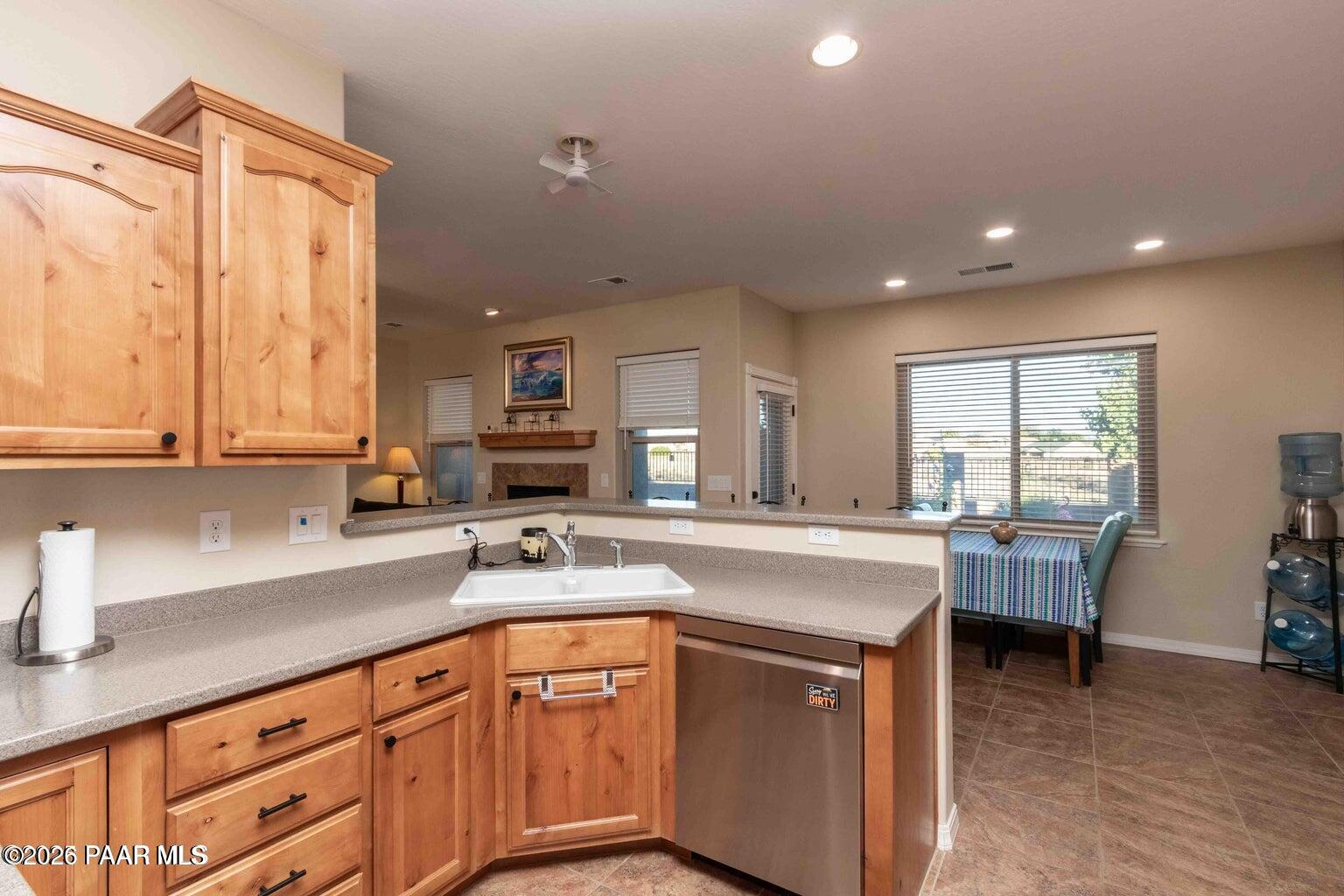 12933 Ponce Street Dewey, AZ 86327 - Photo 11 of 41 a kitchen that has a lot of cabinets in it and wooden floors