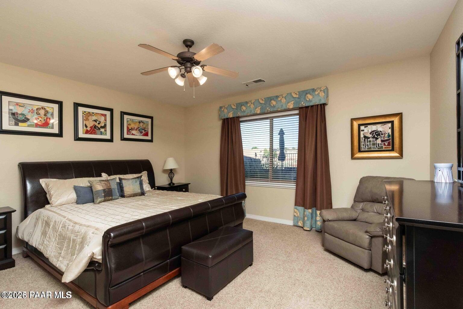 12933 Ponce Street Dewey, AZ 86327 - Photo 15 of 41 a bedroom with a large bed couch and a window