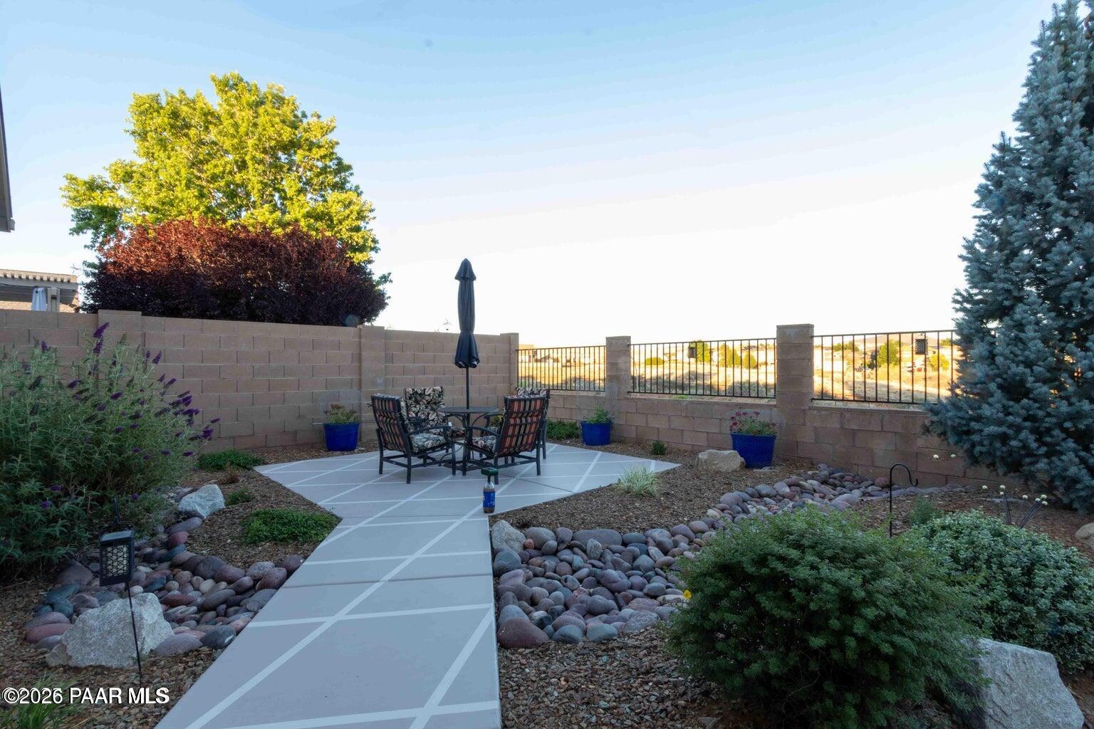 12933 Ponce Street Dewey, AZ 86327 - Photo 25 of 41 a view of a patio with a table and chairs