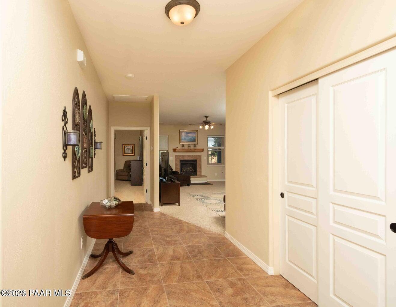 12933 Ponce Street Dewey, AZ 86327 - Photo 5 of 41 a view of a hallway with furniture and a bathroom