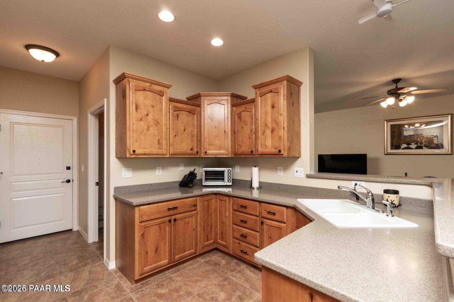 12933 Ponce Street Dewey, AZ 86327 - Photo 10 of 41 a kitchen with a sink stove and cabinets