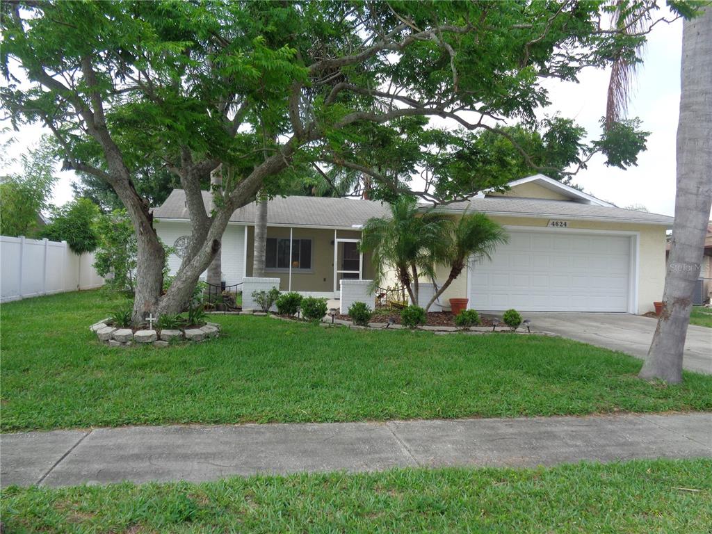 4624 Swallowtail Drive New Port Richey, FL 34653 - Photo 1 of 1 Landscape brings privacy to this lovely home