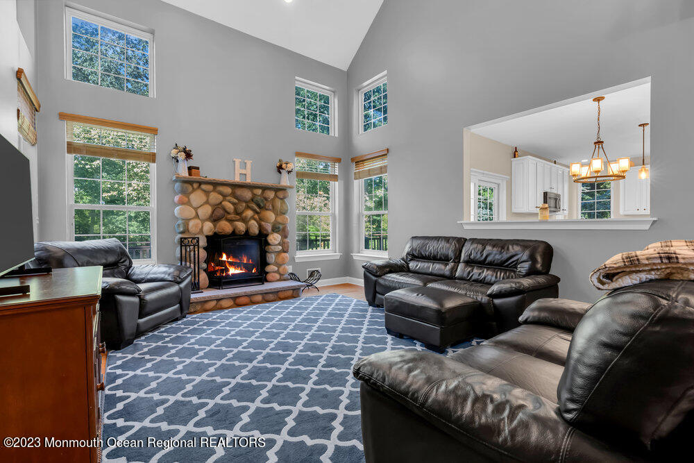 30 Erin Drive Jackson, NJ 08527 - Photo 24 of 105 a living room with furniture a large window and a fireplace