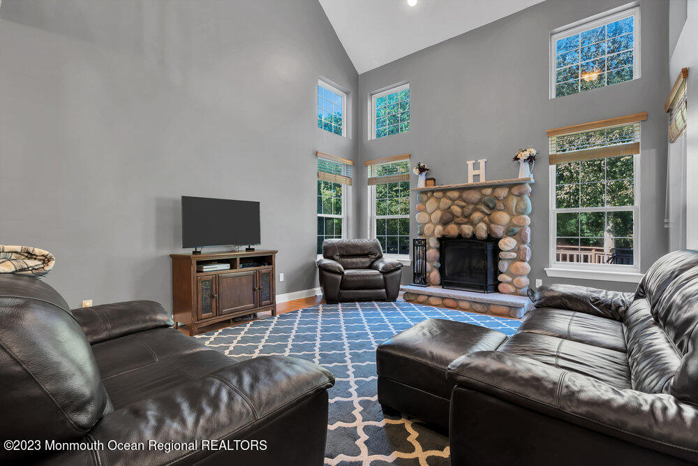 30 Erin Drive Jackson, NJ 08527 - Photo 26 of 105 a living room with furniture and a fireplace