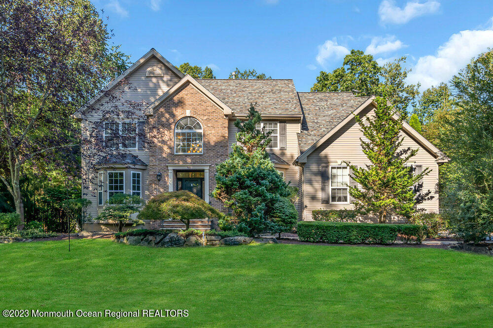 30 Erin Drive Jackson, NJ 08527 - Photo 3 of 105 a view of a house next to a big yard and large trees