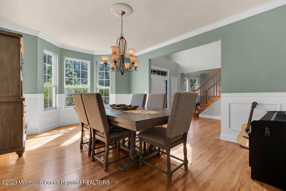 30 Erin Drive Jackson, NJ 08527 - Photo 36 of 105 a view of a dining room with furniture window and wooden floor