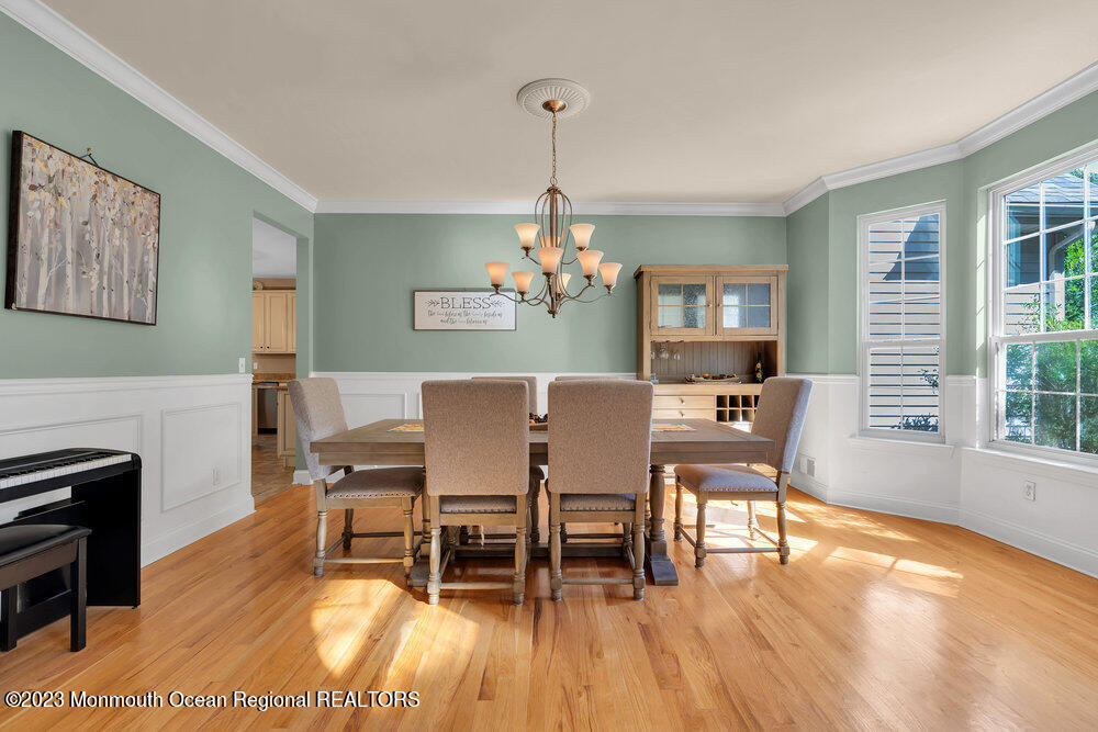 30 Erin Drive Jackson, NJ 08527 - Photo 38 of 105 a dining room with furniture a chandelier and wooden floor