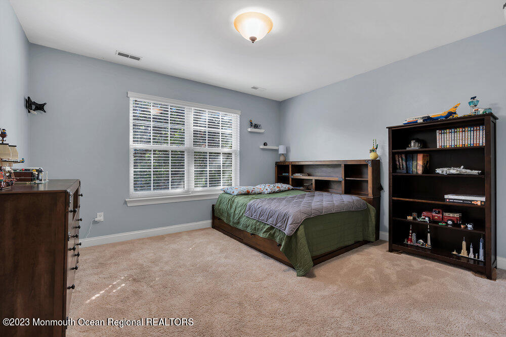 30 Erin Drive Jackson, NJ 08527 - Photo 44 of 105 a bedroom with a bed and a window