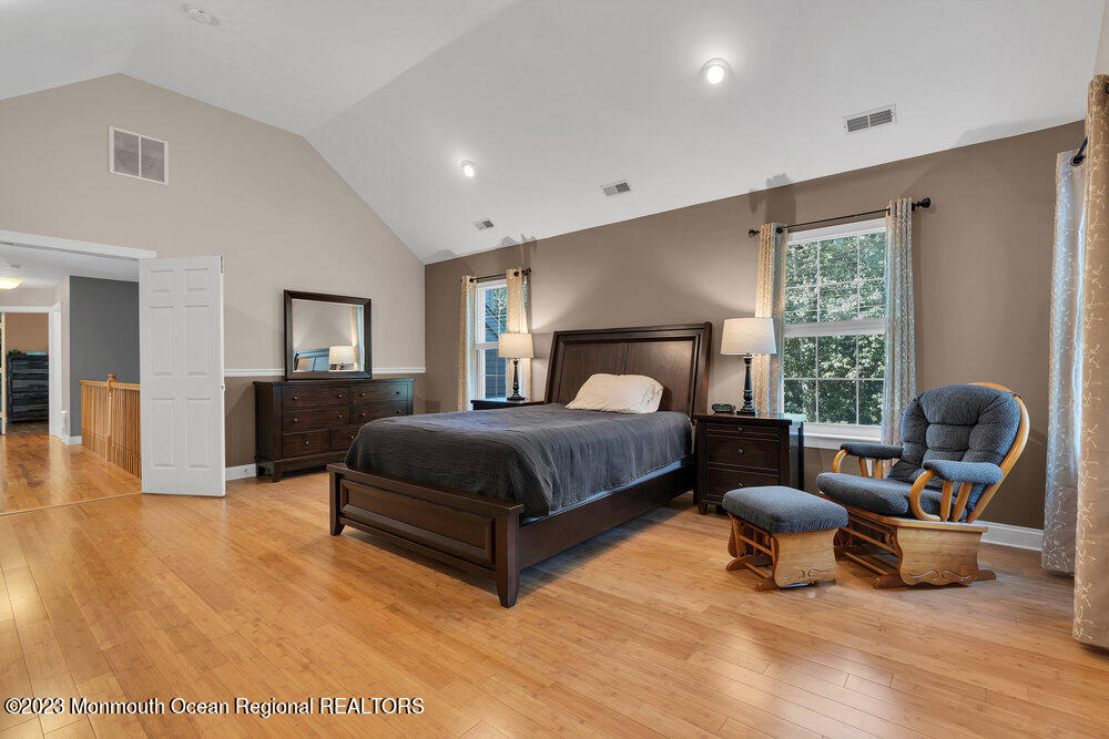 30 Erin Drive Jackson, NJ 08527 - Photo 47 of 105 a bedroom with a bed and chair