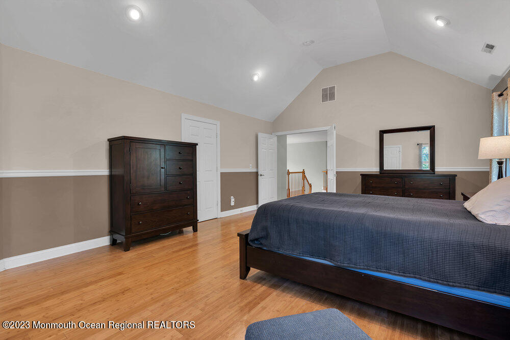 30 Erin Drive Jackson, NJ 08527 - Photo 50 of 105 a bedroom with a bed and a refrigerator