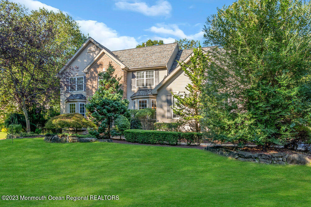 30 Erin Drive Jackson, NJ 08527 - Photo 5 of 105 a front view of a house with a garden