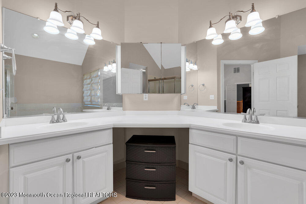 30 Erin Drive Jackson, NJ 08527 - Photo 52 of 105 a bathroom with a sink vanity and a mirror