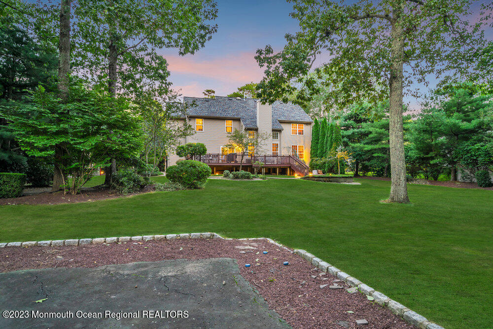 30 Erin Drive Jackson, NJ 08527 - Photo 90 of 105 a front view of a house with a garden and trees