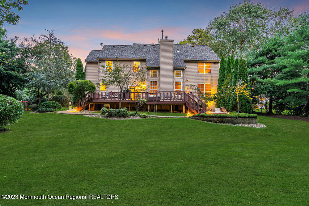 30 Erin Drive Jackson, NJ 08527 - Photo 91 of 105 a front view of a house with a yard table and chairs