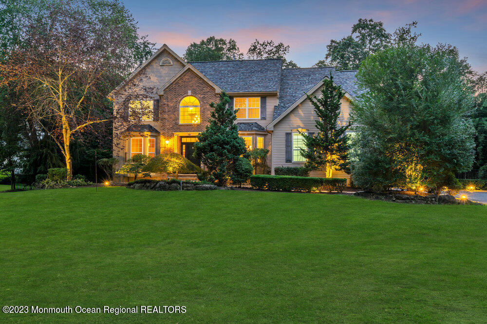 30 Erin Drive Jackson, NJ 08527 - Photo 99 of 105 a front view of house with a garden