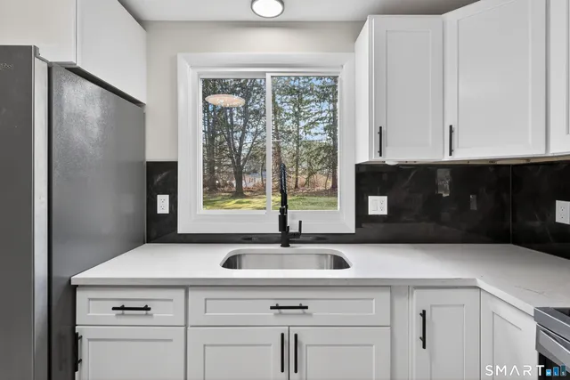 a kitchen with a sink and cabinets