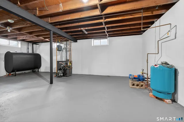 a room with gym equipment and a mirror