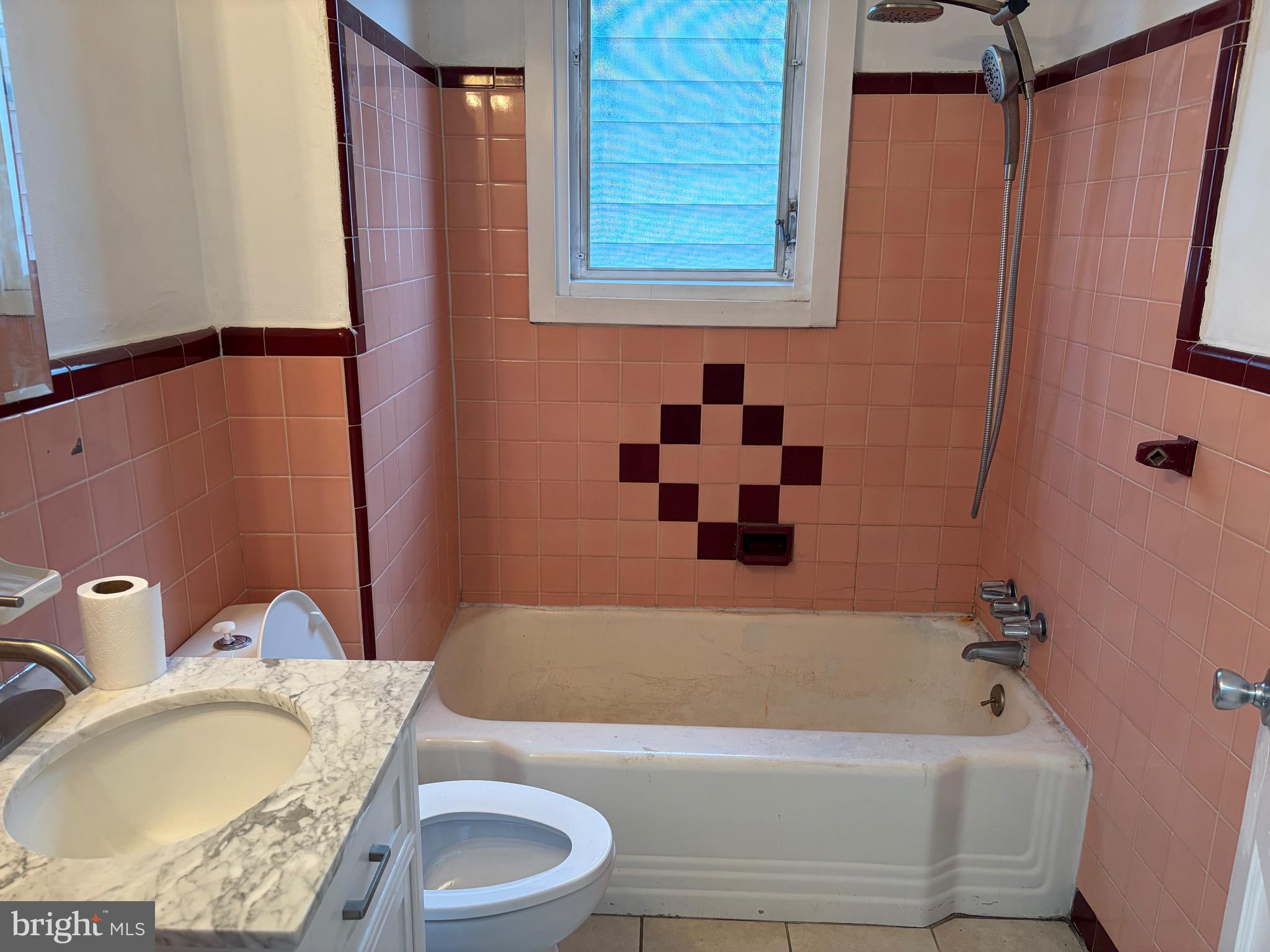 8 Overhill Road, Unit D Upper Darby, PA 19082 - Photo 3 of 5 a bathroom with a granite countertop sink and a bathtub