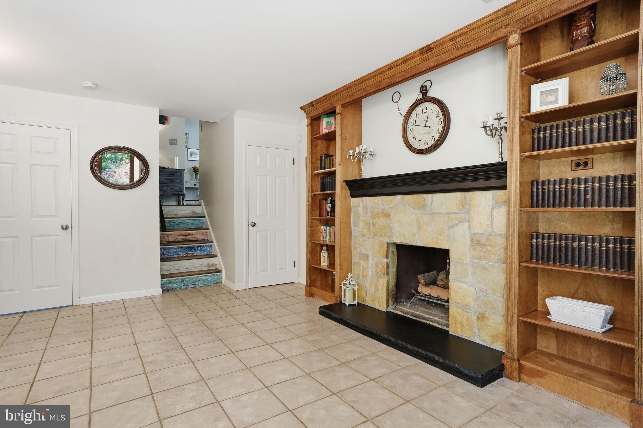 621 River Road Yardley, PA 19067 - Photo 37 of 75 a view of a livingroom with a fireplace and a window