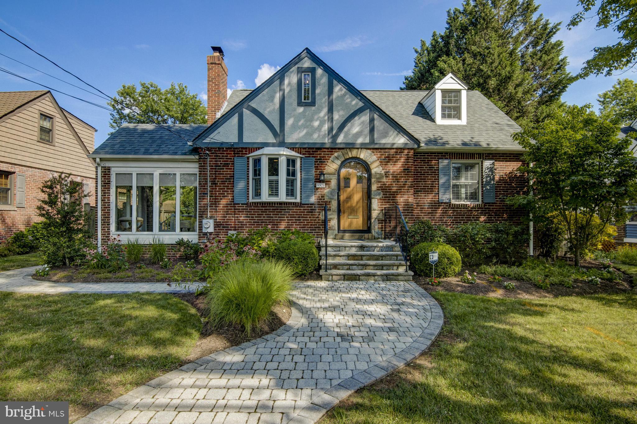 9921 Rogart Road Silver Spring, MD 20901 - Photo 1 of 30 a front view of a house with a yard