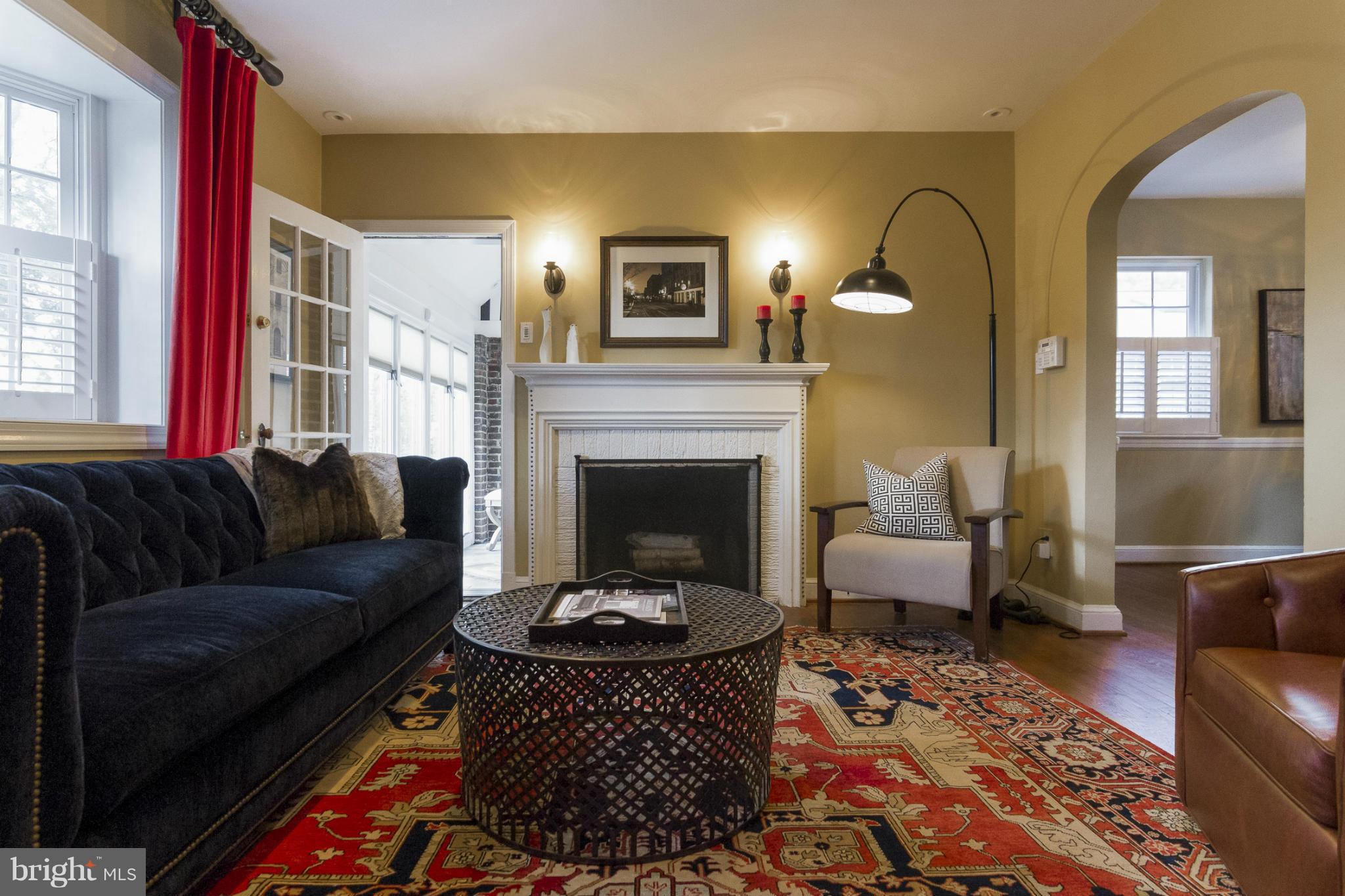 9921 Rogart Road Silver Spring, MD 20901 - Photo 2 of 30 a living room with furniture and a fireplace
