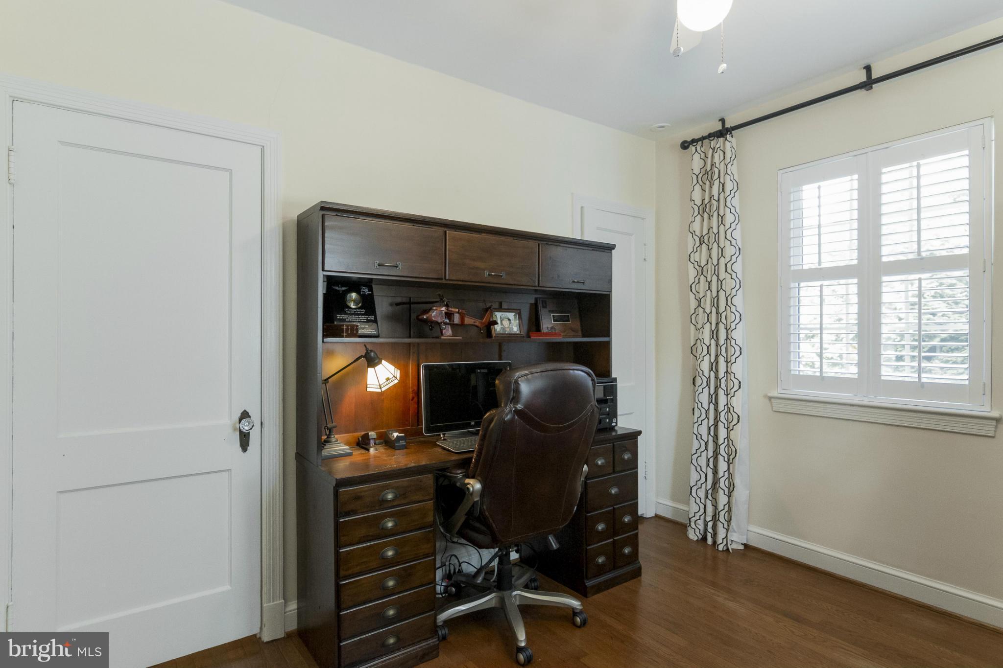 9921 Rogart Road Silver Spring, MD 20901 - Photo 11 of 30 a view of workspace with wooden floor windows