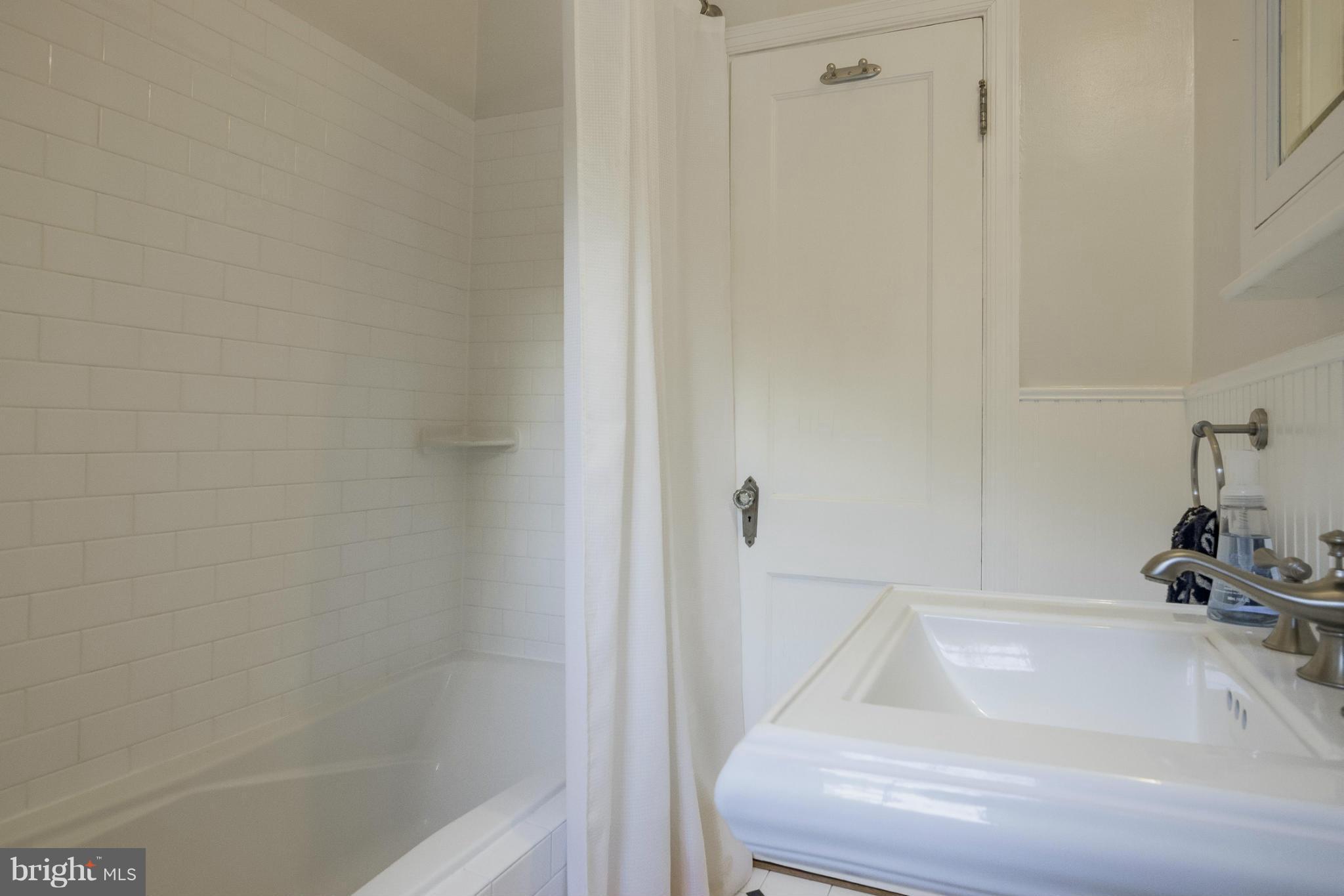 9921 Rogart Road Silver Spring, MD 20901 - Photo 14 of 30 a bathroom with a tub