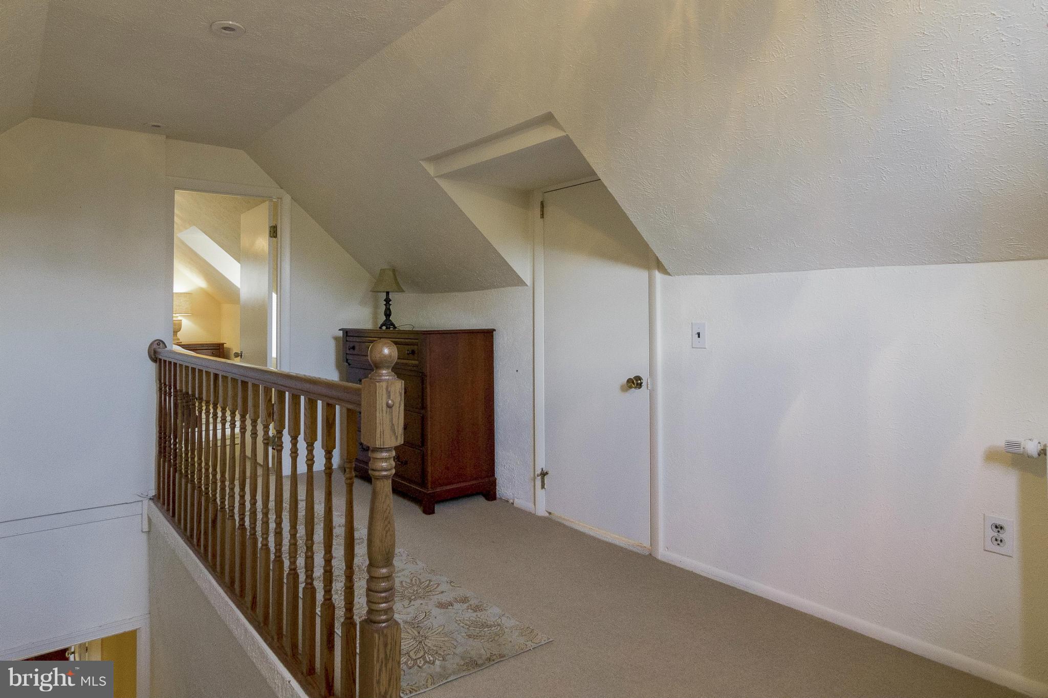 9921 Rogart Road Silver Spring, MD 20901 - Photo 15 of 30 a view of a hallway with windows