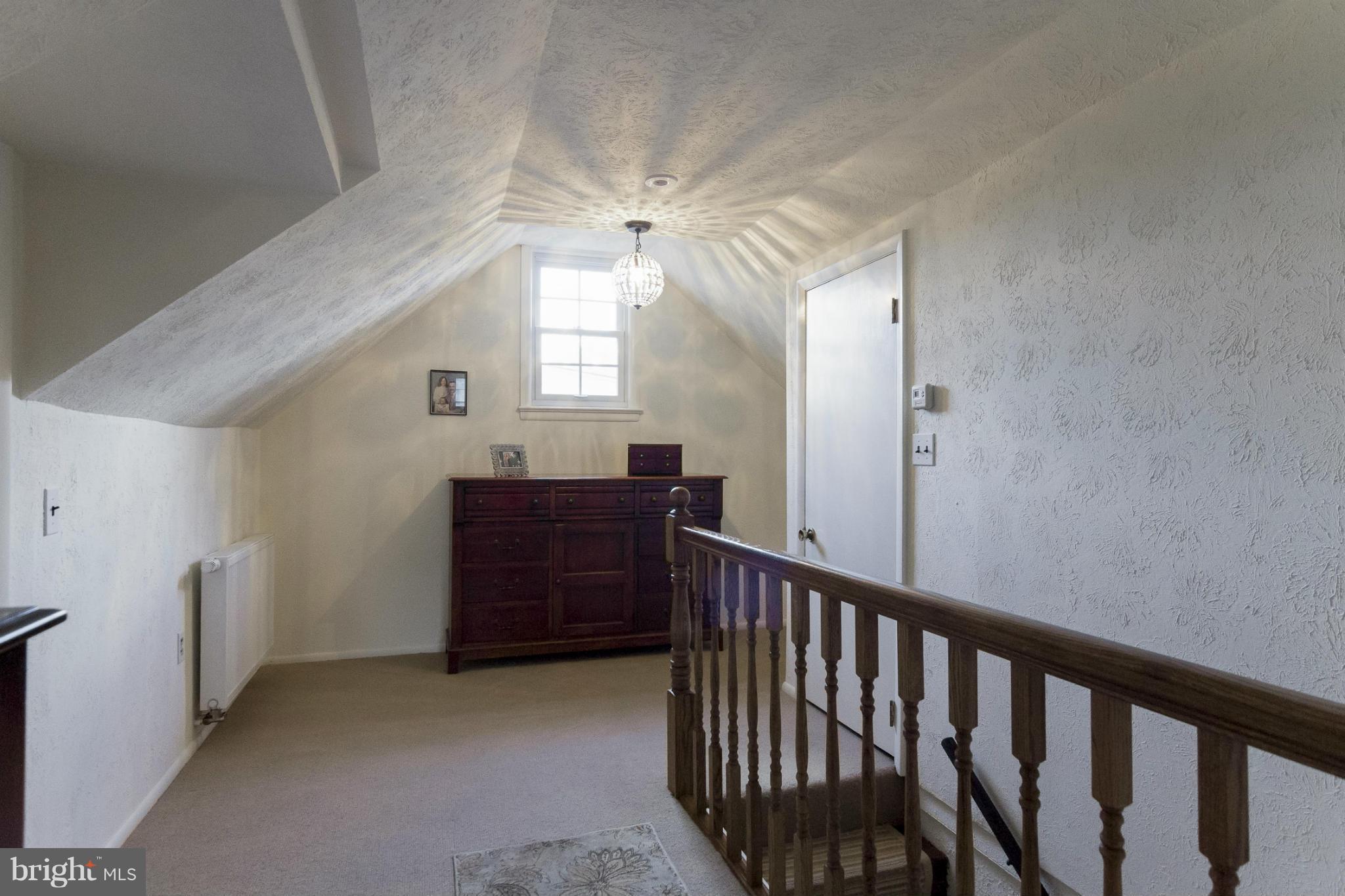 9921 Rogart Road Silver Spring, MD 20901 - Photo 18 of 30 a view of a hallway to a livingroom with furniture
