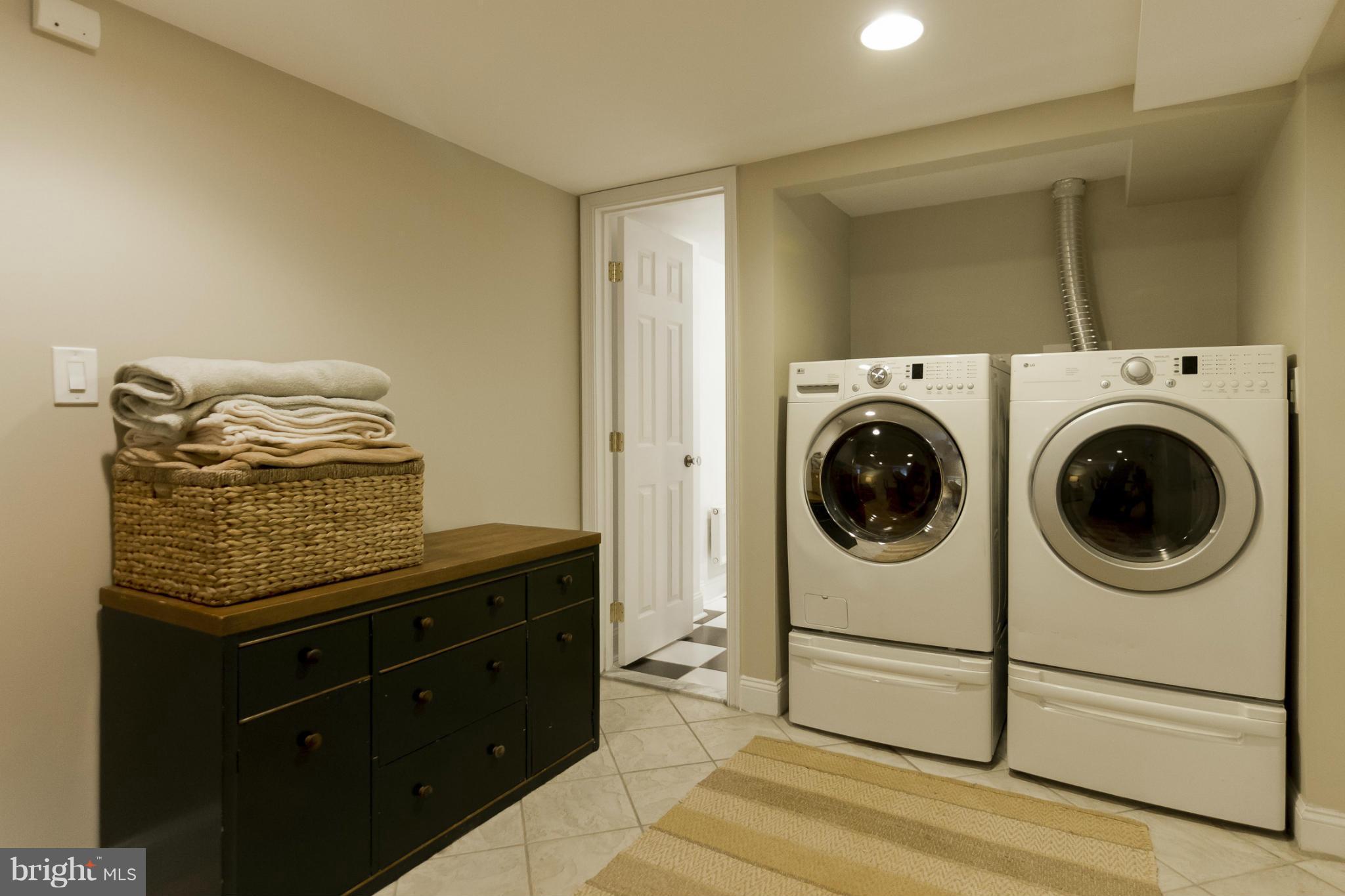 9921 Rogart Road Silver Spring, MD 20901 - Photo 25 of 30 a utility room with dryer and washer