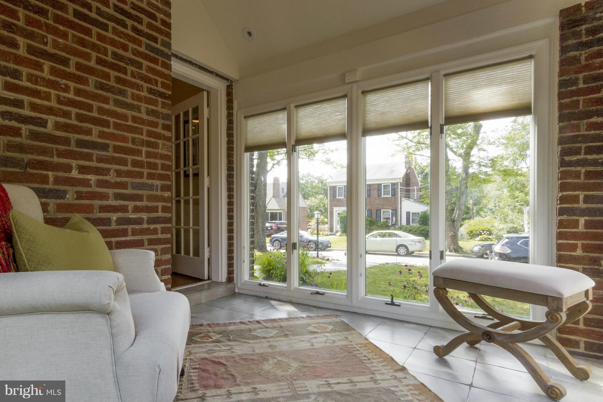 9921 Rogart Road Silver Spring, MD 20901 - Photo 27 of 30 a living room with furniture and a floor to ceiling window
