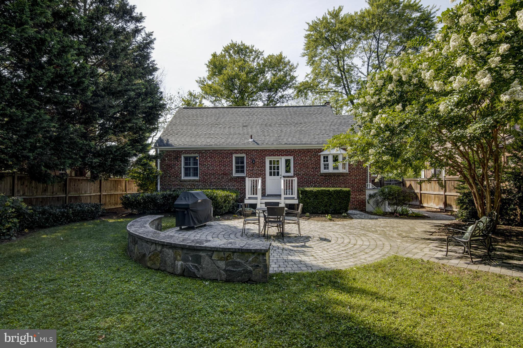 9921 Rogart Road Silver Spring, MD 20901 - Photo 28 of 30 a view of a house with backyard and sitting area