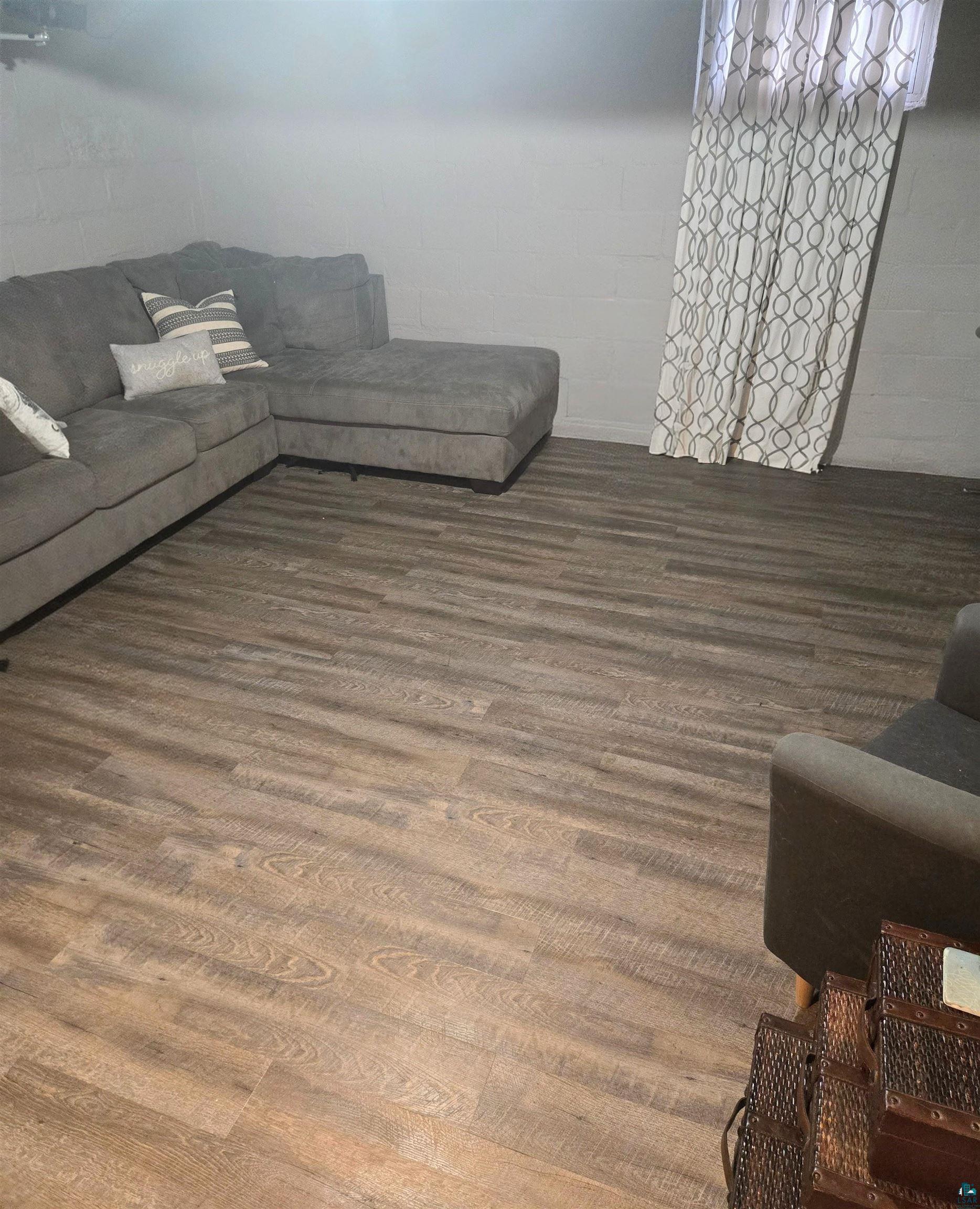 4327 West 5th Street Duluth, MN 55807 - Photo 21 of 25 Living room with concrete block wall