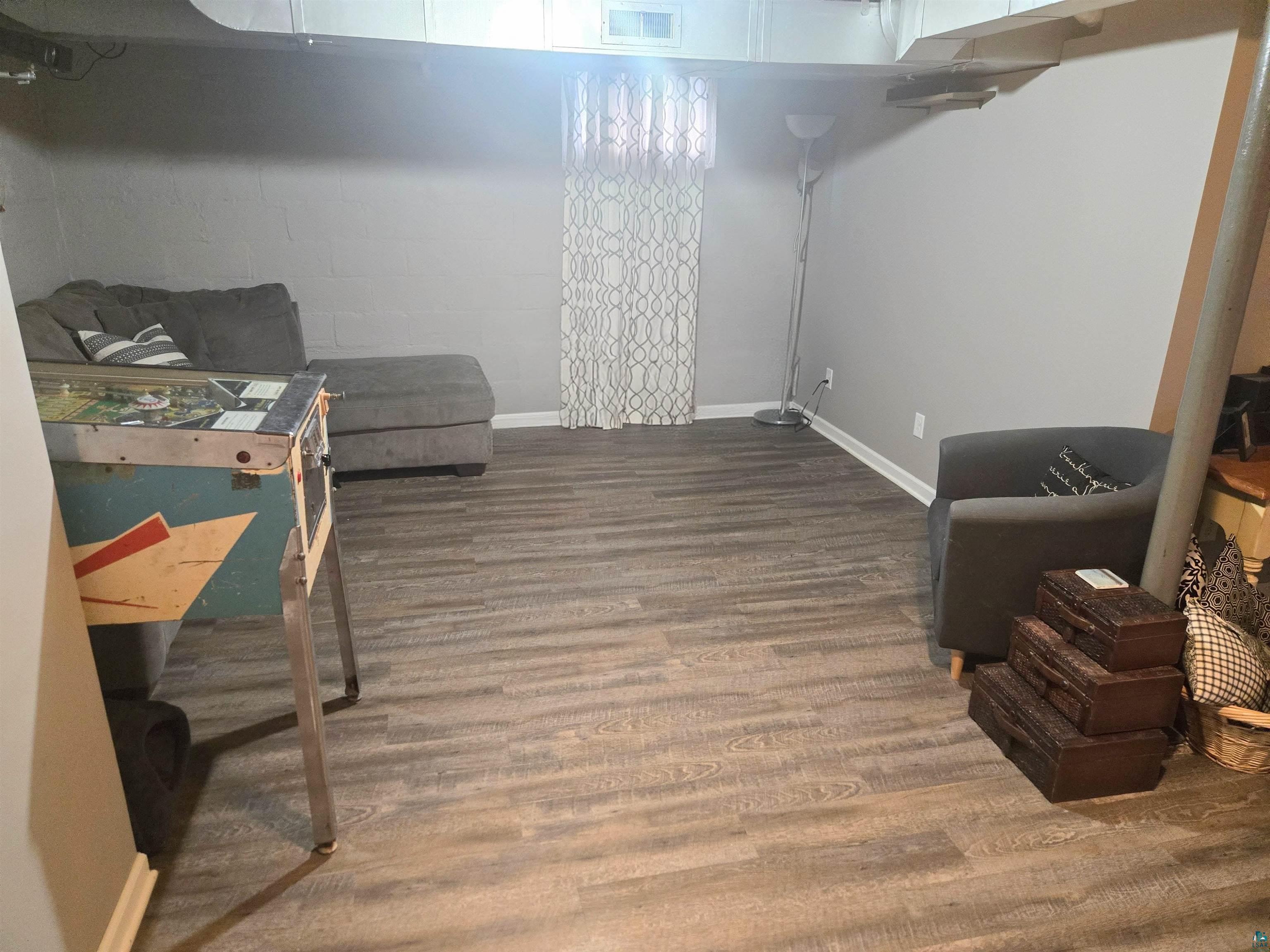 4327 West 5th Street Duluth, MN 55807 - Photo 23 of 25 Basement featuring baseboards and wood finished floors
