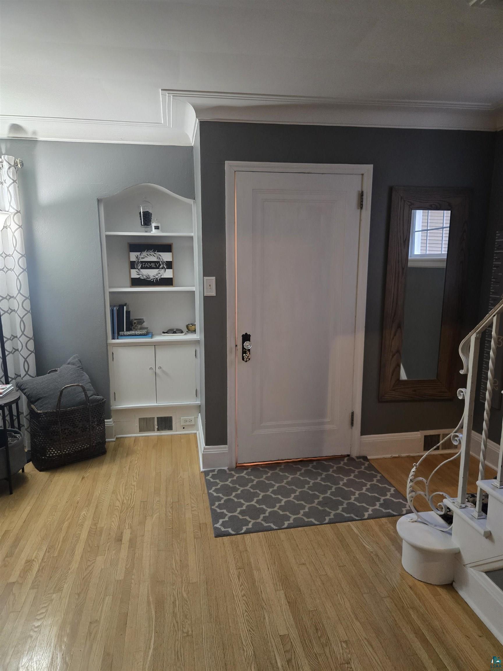 4327 West 5th Street Duluth, MN 55807 - Photo 9 of 25 Entryway with light wood-style floors and crown molding