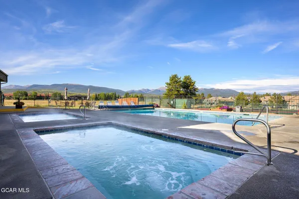 a view of swimming pool and outdoor seating