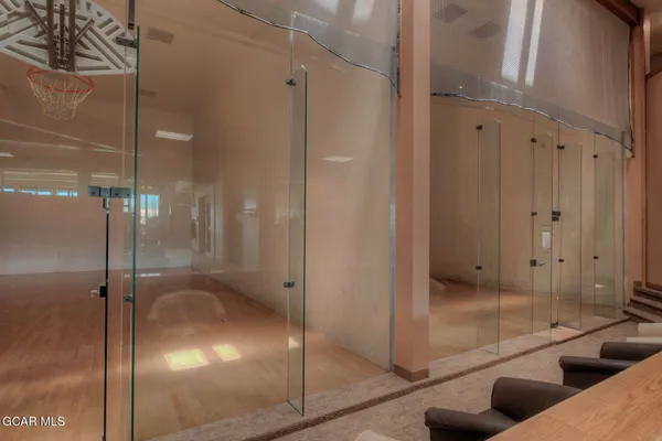 a bathroom with a glass shower door