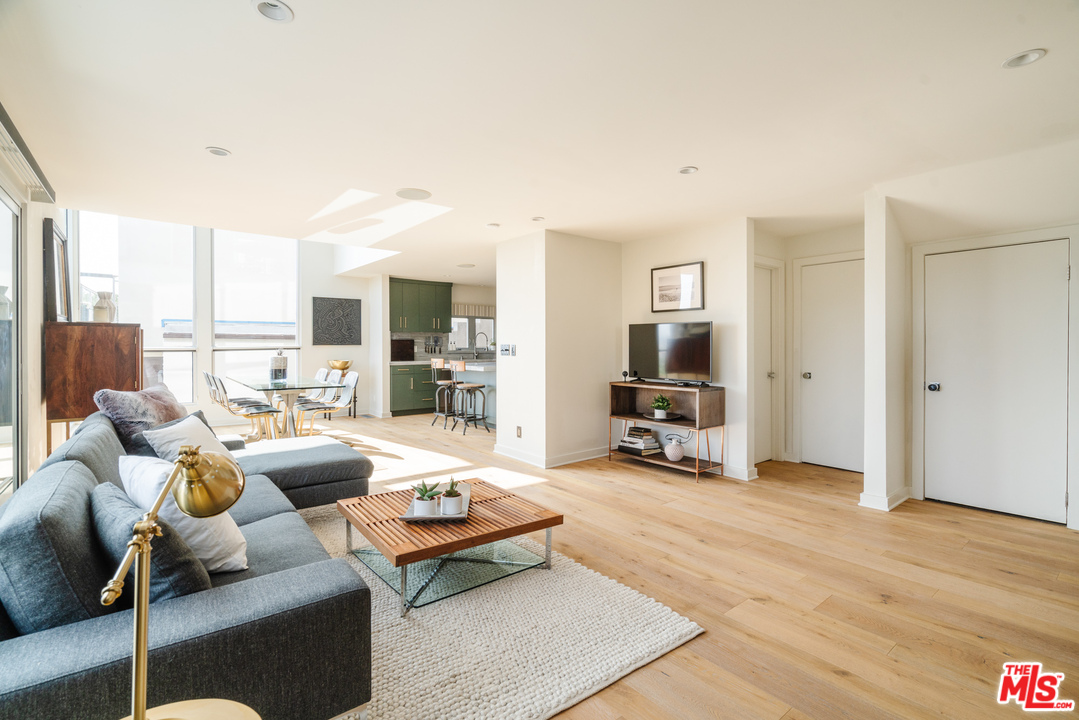 9318 Warbler Way Los Angeles, CA 90069 - Photo 2 of 46 a living room with furniture and a flat screen tv