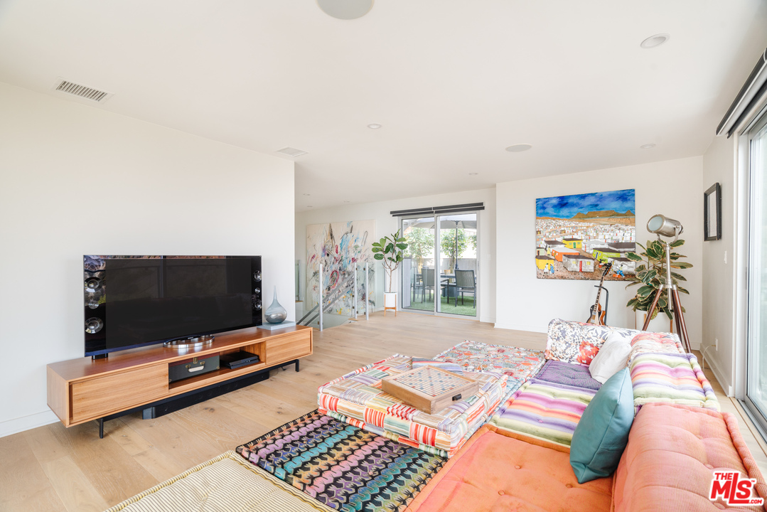 9318 Warbler Way Los Angeles, CA 90069 - Photo 16 of 46 a living room with furniture and a flat screen tv
