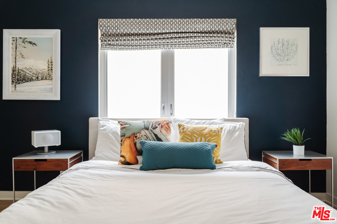 9318 Warbler Way Los Angeles, CA 90069 - Photo 18 of 46 a bedroom with bed and window