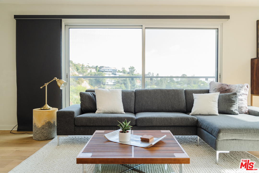 9318 Warbler Way Los Angeles, CA 90069 - Photo 3 of 46 a living room with furniture and a large window