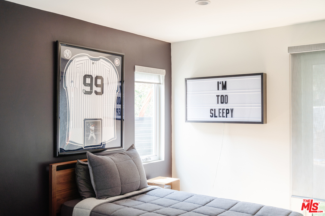 9318 Warbler Way Los Angeles, CA 90069 - Photo 21 of 46 a bed room with a bed