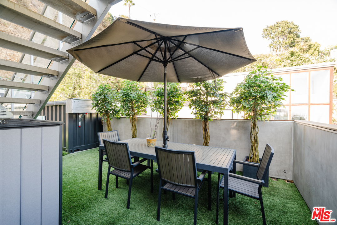 9318 Warbler Way Los Angeles, CA 90069 - Photo 36 of 46 a view of chair and table in the patio