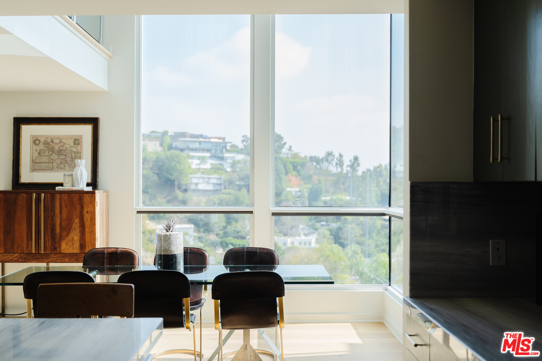 9318 Warbler Way Los Angeles, CA 90069 - Photo 6 of 46 a living room with furniture tv and large window