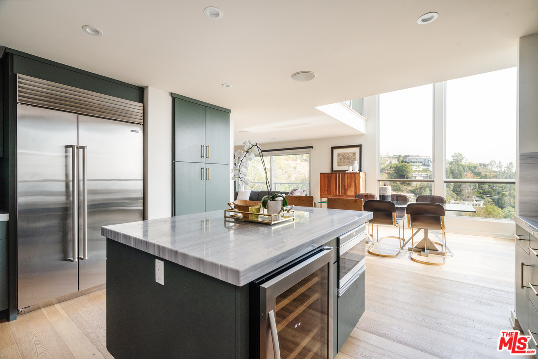 9318 Warbler Way Los Angeles, CA 90069 - Photo 7 of 46 a view of a kitchen and living room